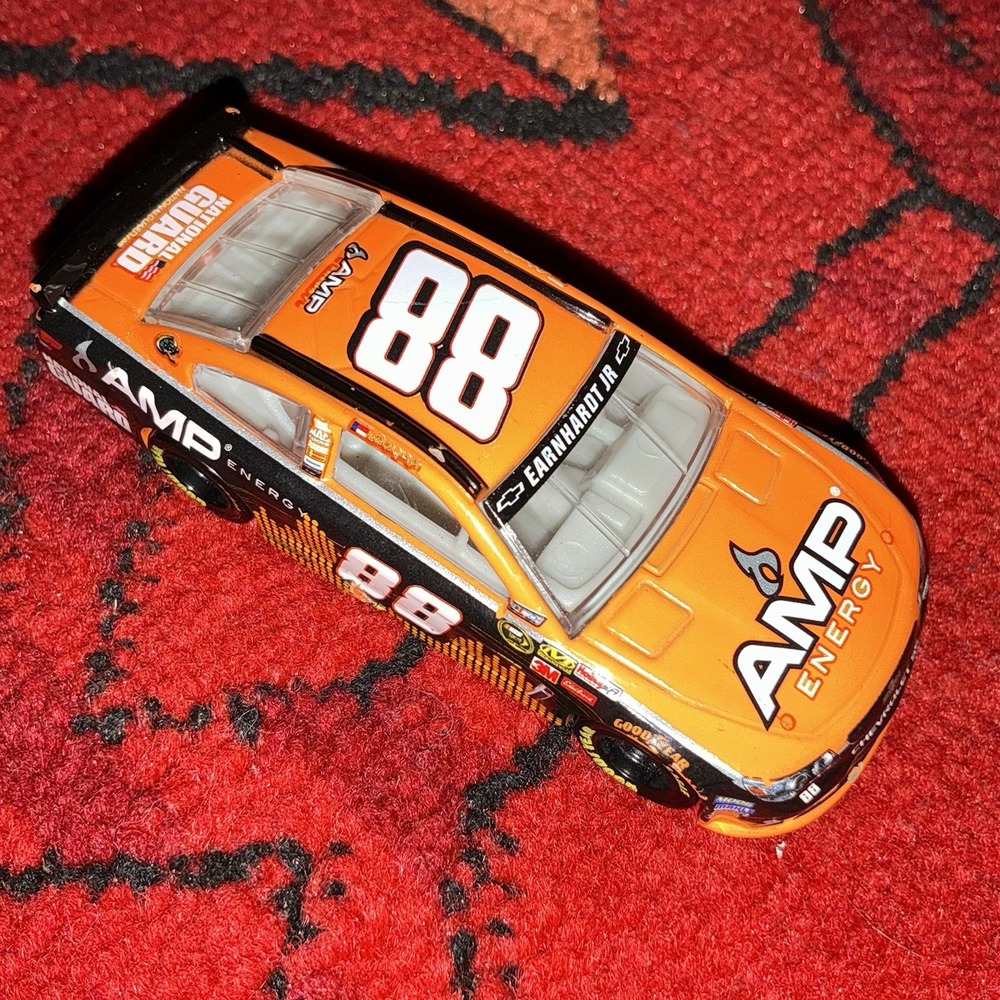 Dale Earnhardt Jr #88 Amp Energy Orange Action 1/64 2013